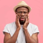 a man battling dental anxiety from bruxism